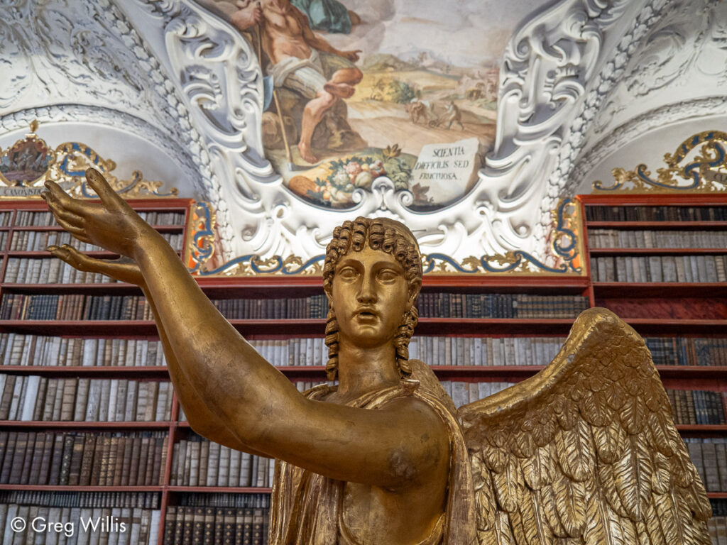 Statue, books, & frescos.